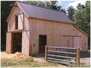 The Battenkill Barn - Inexpensive stock plans are available for this one-car or one-tractor barn. The design is flexible enough for a bunch of uses. This one, in Vermont, is being used to shelter sheep and to store hay. 