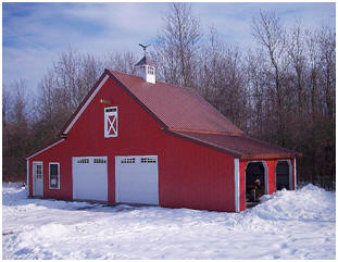Here's a combination garage, shed and workshop in upstate New York. It's just one of fifteen  different layouts that you can build from the $59.00 Walnut Pole-Barn plan set by architect Don Berg